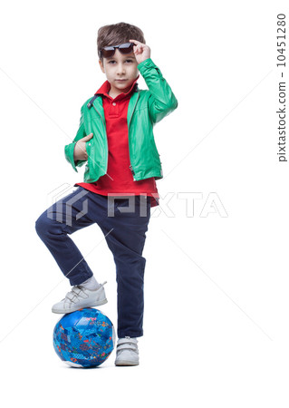 Athletic cute boy posing with ball in studio 10451280