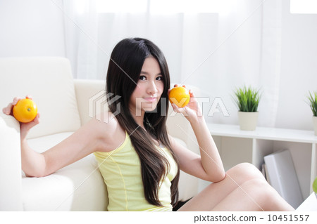 woman with fresh fruits orange 10451557