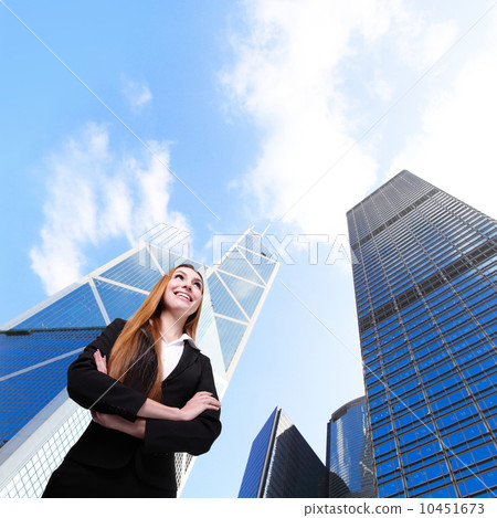 Business woman smile with office building Business woman smile with office building 10451673