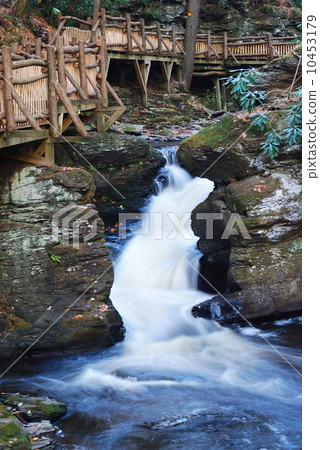 Autumn creek with hiking trail and rocks 10453179