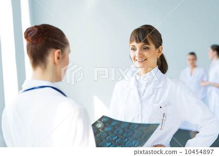 Doctor talking with a colleague Doctor talking with a colleague 10454897