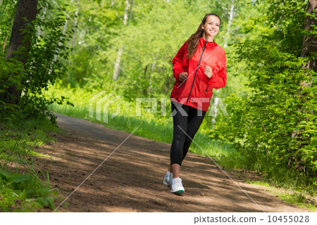 healthy young female athlete running 10455028