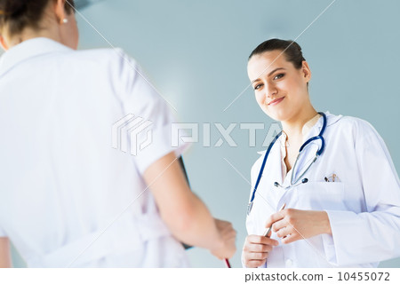 Doctor talking with a colleague Doctor talking with a colleague 10455072