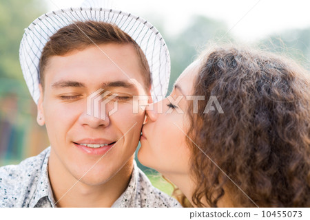 girl kissing a man on the cheek girl kissing a man on the cheek 10455073