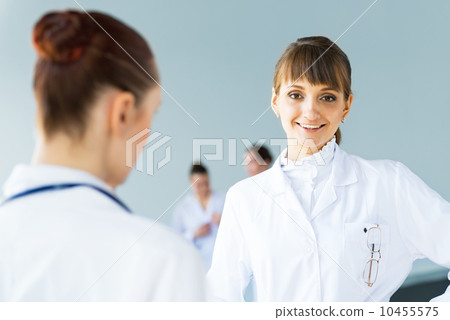 Doctor talking with a colleague Doctor talking with a colleague 10455575