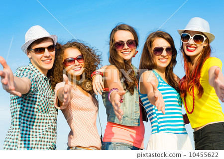 group of young people wearing sunglasses and hat group of young people wearing sunglasses and hat 10455622
