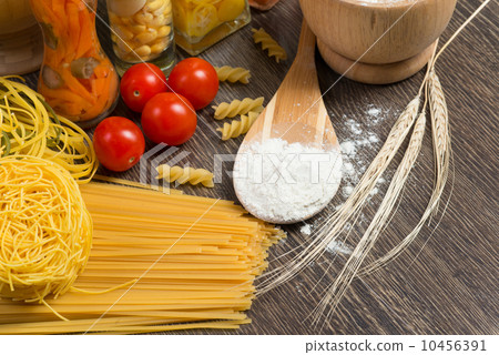 pasta, tomatoes and flour on the spoon pasta, tomatoes and flour on the spoon 10456391