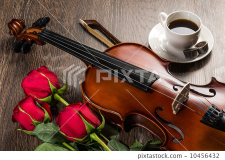 Violin, rose, coffee and music books Violin, rose, coffee and music books 10456432