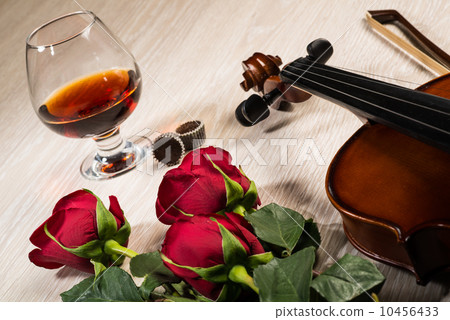 Violin, rose, glass of champagne and music books Violin, rose, glass of champagne and music books 10456433