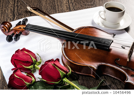 Violin, rose, glass of champagne and music books Violin, rose, glass of champagne and music books 10456496