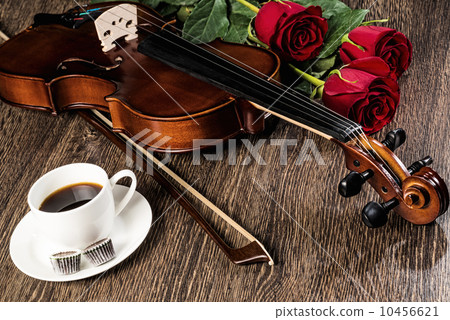 Violin, rose, coffee and music books Violin, rose, coffee and music books 10456621