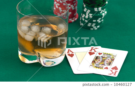 Counters of a card and a glass of whisky. 10460127