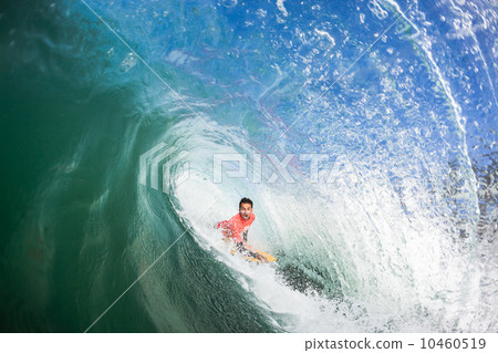 Surfing Body-Boarder Inside Tube Wave Surfing Body-Boarder Inside Tube Wave 10460519