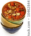 Colorful Ceramic Bowls Stacked with Maryland Crab Stew 10462844