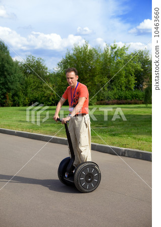 A man on an electric scooter-Segway A man on an electric scooter-Segway 10463660