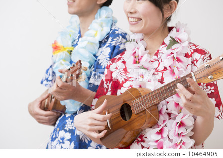 A couple wearing an Aloha shirt A couple wearing an Aloha shirt 10464905