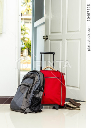 red travel bag , backpack and shoes 10467528