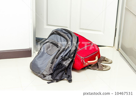 red travel bag , backpack and shoes 10467531