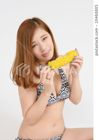 A young woman eating corn A young woman eating corn 10468805