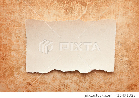 ripped piece of paper on grunge paper background. vintage retro 10471323