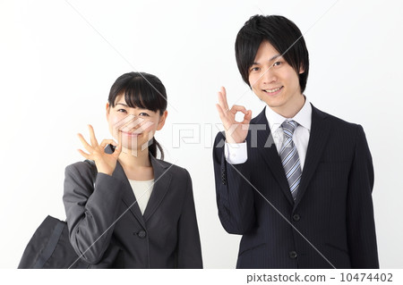 Businesswoman · businessman who makes an OK sign 10474402