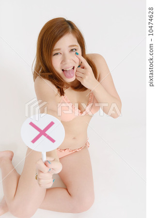 Women in swimsuit appearing cross-marks 10474628