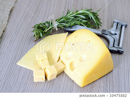 Cheese on Wooden Background 10475882