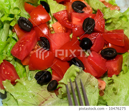 Delicious salad with tomatoes, olives and peppers. Delicious salad with tomatoes, olives and peppers. 10476275