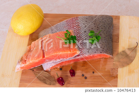 Trout fillet on wooden background Trout fillet on wooden background 10476413