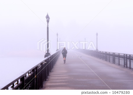 A lonely lady crossing a bridge 10479280