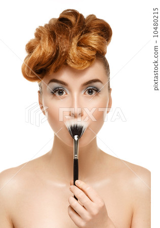Beauty portrait of pretty woman with brush for makeup 10480215