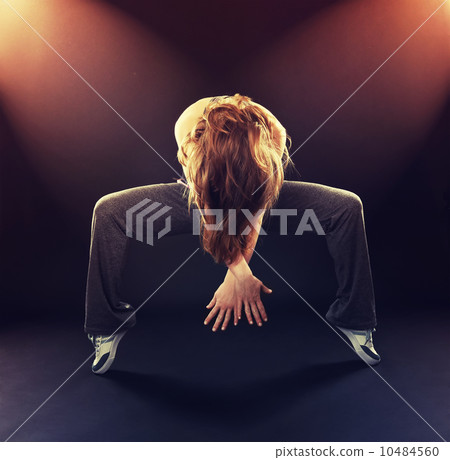 woman dancer dancing modern dance, jump on a black 10484560