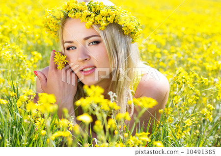 Young beautiful girl in the yellow field Young beautiful girl in the yellow field 10491385