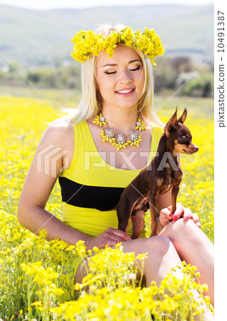 Pretty girl on the nature with her dog 10491387