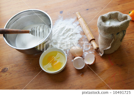 flour on wooden background flour on wooden background 10491725