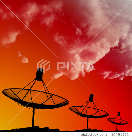 Satellite dishes on rooftop with cloud in morning sky 10491921