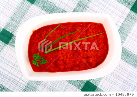 Bright red ajvar in white bowl 10493979