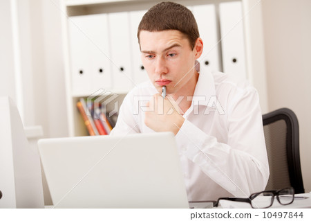 man thinking in office man thinking in office 10497844