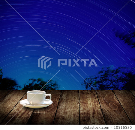 Drink coffee cup with star trails background Drink coffee cup with star trails background 10516580