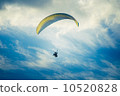 Paragliding extreme Sport with blue Sky and clouds on background Healthy Lifestyle and Freedom  10520828