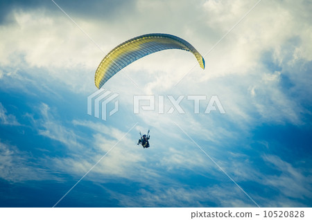 Paragliding extreme Sport with blue Sky and clouds on background Healthy Lifestyle and Freedom Paragliding extreme Sport with blue Sky and clouds on background Healthy Lifestyle and Freedom 10520828