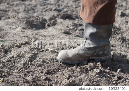 Boots on dry earth. 10522401