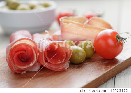 dried jamon slices on wood table dried jamon slices on wood table 10523172