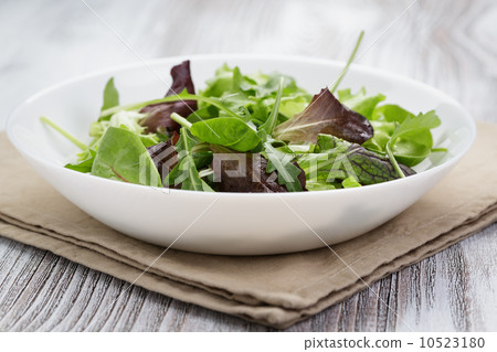 mesclun mix salad in white bowl mesclun mix salad in white bowl 10523180