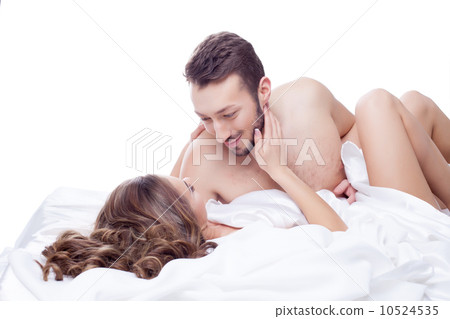 Smiling man looking at his mistress lying in bed Smiling man looking at his mistress lying in bed 10524535