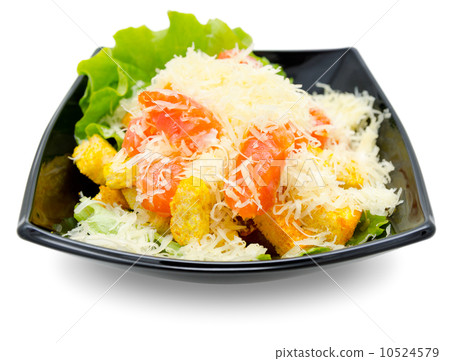 caesar salad in black dish 10524579