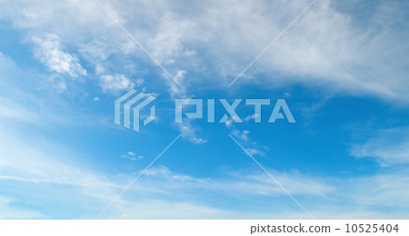 fluffy clouds in the blue sky 10525404