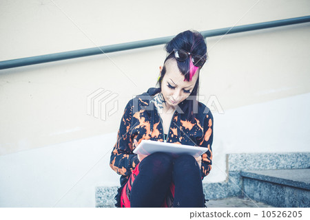 young beautiful punk dark girl using tablet 10526205