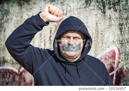 Demonstrator with a tape on a mouth Demonstrator with a tape on a mouth 10526937