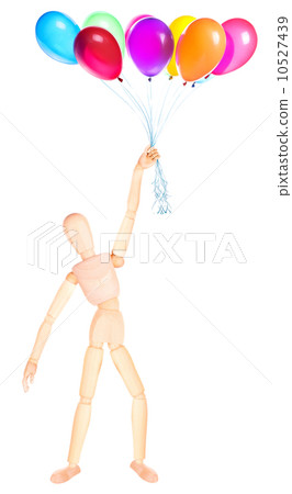 wooden Dummy holding flying balloons isolated wooden Dummy holding flying balloons isolated 10527439